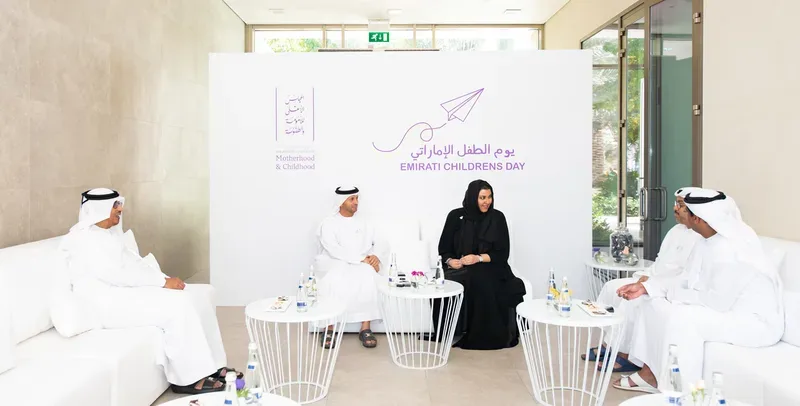 Emirati Children’s Day VIP lounge with guests seated in front of a branded Motherhood and Childhood backdrop