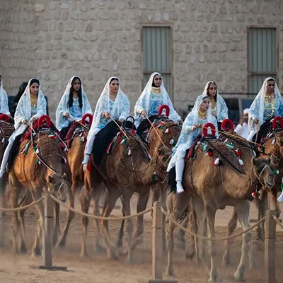 emirati-women-traditional-camel-parade