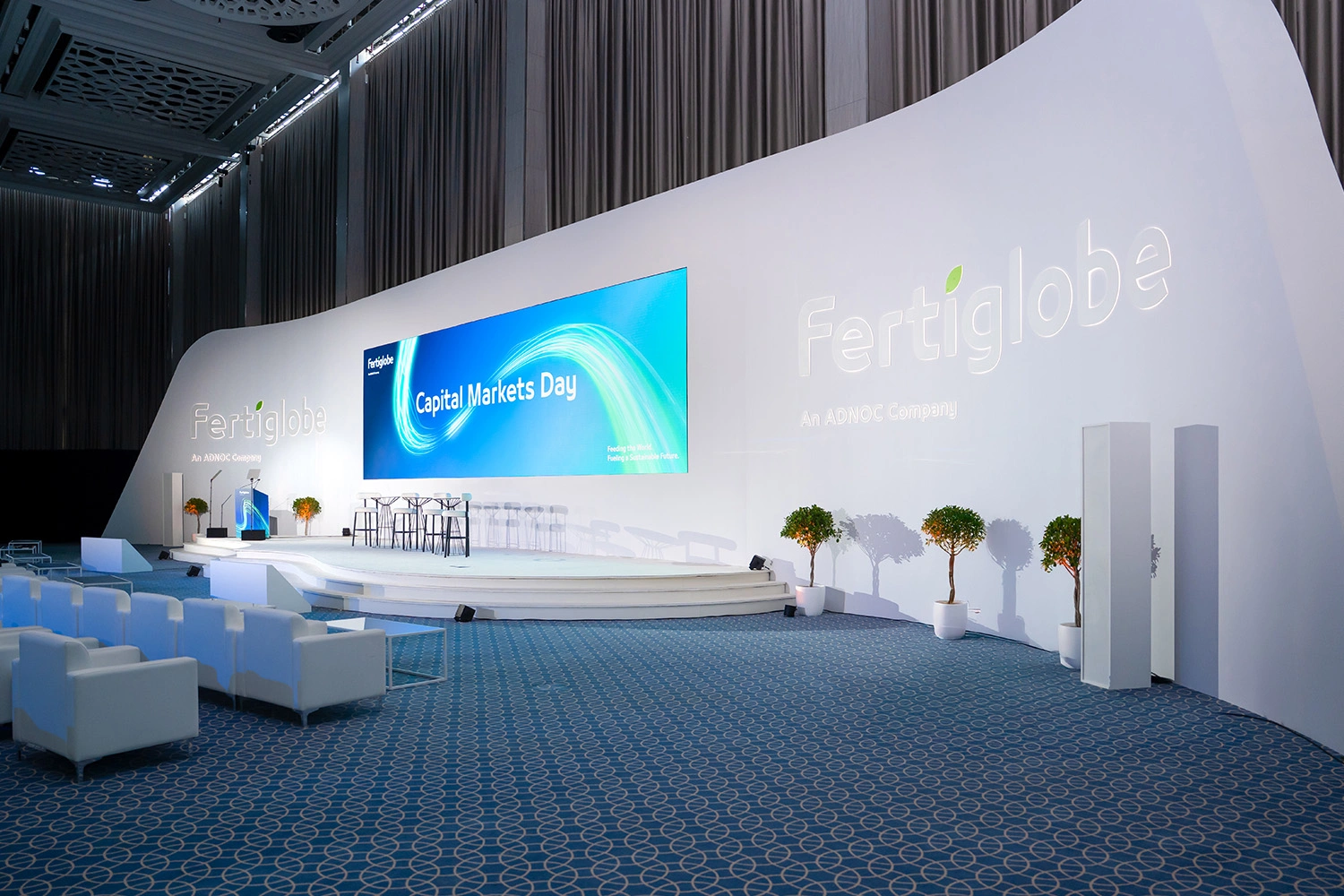 An investor experience moving from an interactive pre-function story of Fertiglobe’s six key elements into clear management presentations inside the ballroom.