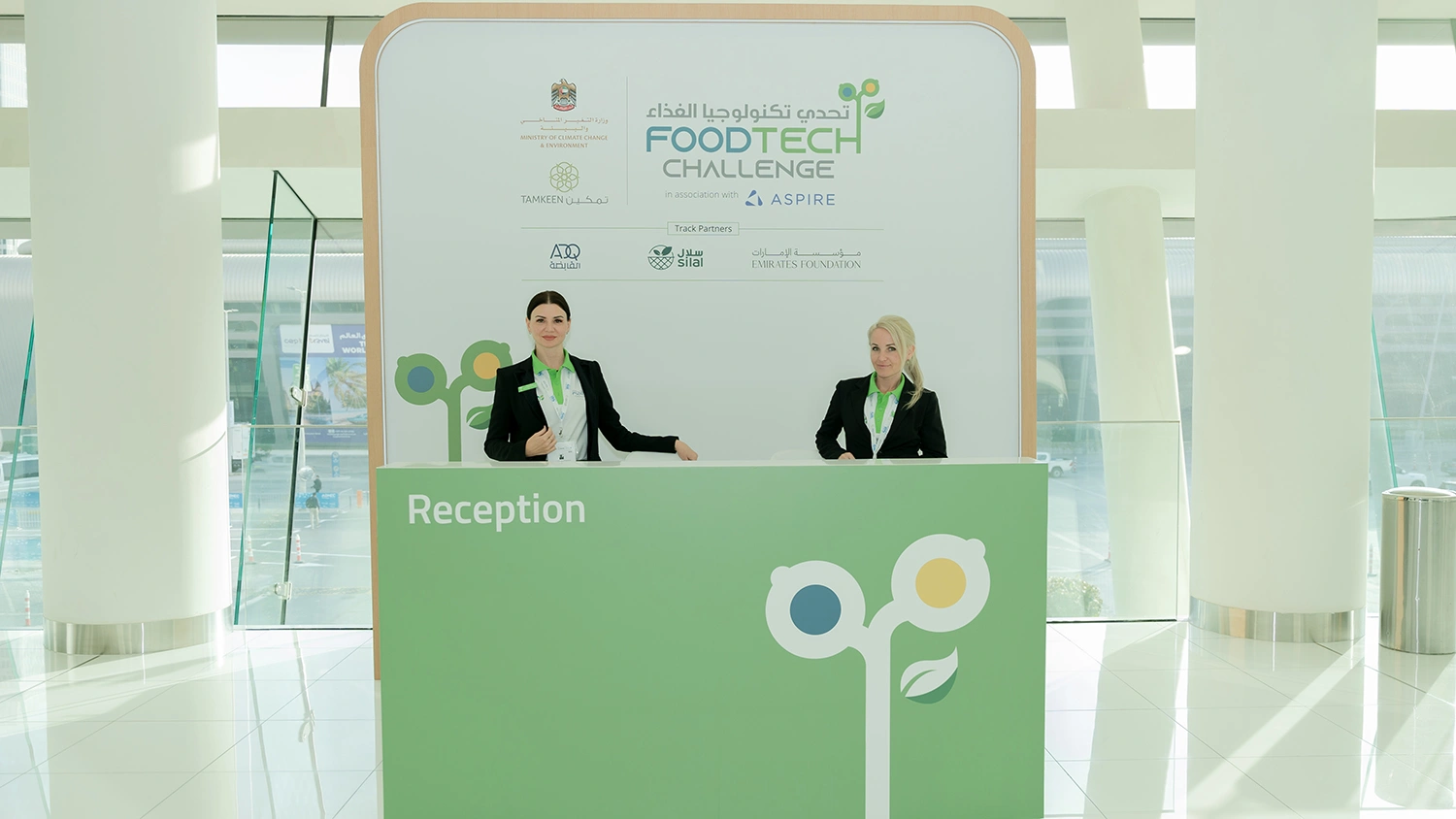 Evolution Scenic FoodTech Challenge reception desk with branded backdrop and delegate check-in staff