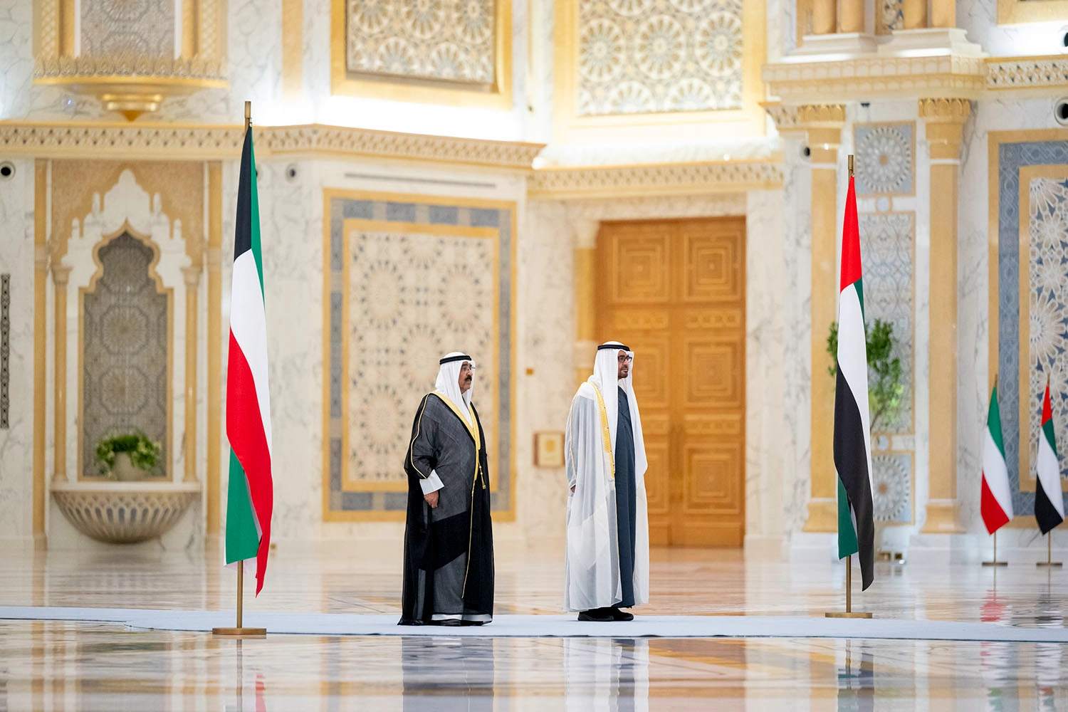 State arrival reception setup featuring custom golden staging and diplomatic podiums in Abu Dhabi