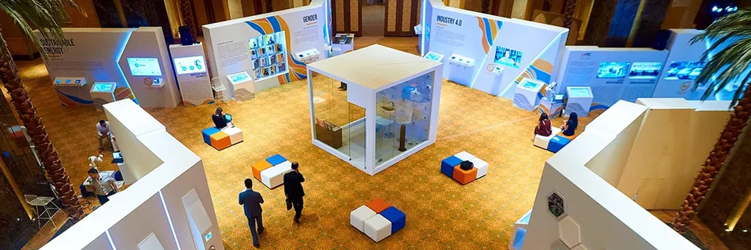 Seven themed hubs, programmed touchscreens, AI stations and a dedicated photography gallery transformed the Emirates Palace atrium into an explorable policy environment.