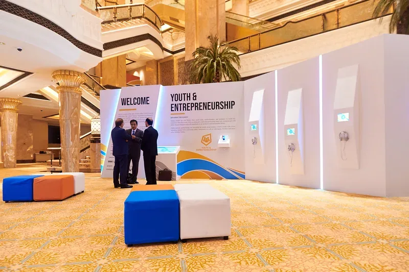 Delegates exploring sustainable manufacturing displays built by Evolution Scenic inside Emirates palace Abu Dhabi venue
